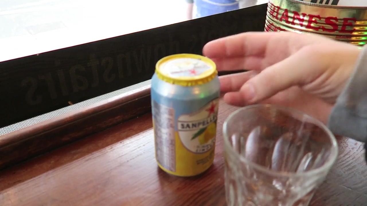 San Pellegrino Limonata can and glass on the window counter