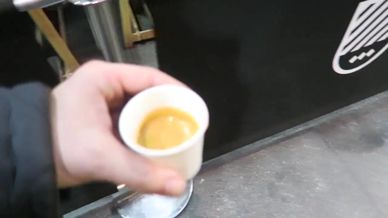 An espresso beside the Department of Coffee and Social Affairs counter.
