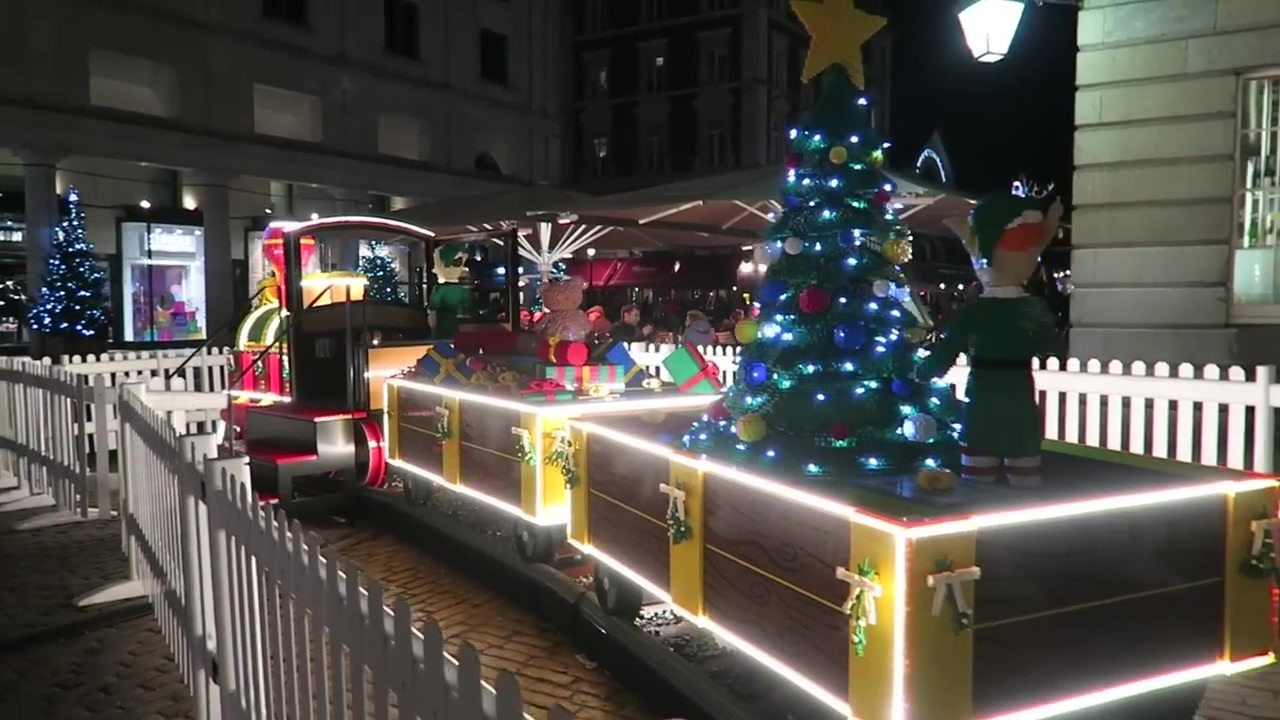 LEGO Santa Express Christmas train display with a tree and presents at Covent Garden.