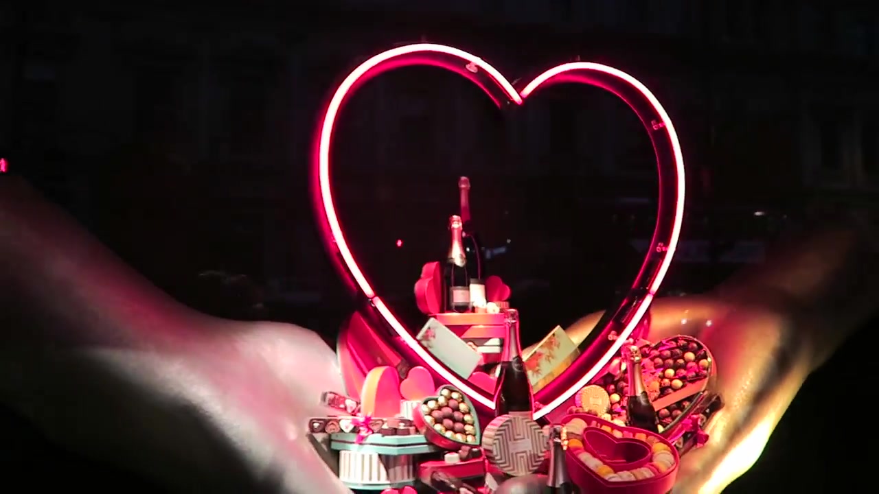 Illuminated heart around a Valentine display in a Fortnum and Mason window