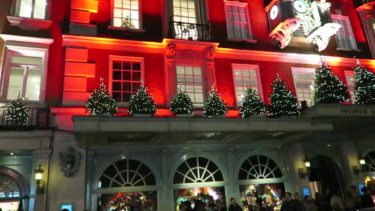 Fortnum and Mason illuminated red with Christmas trees