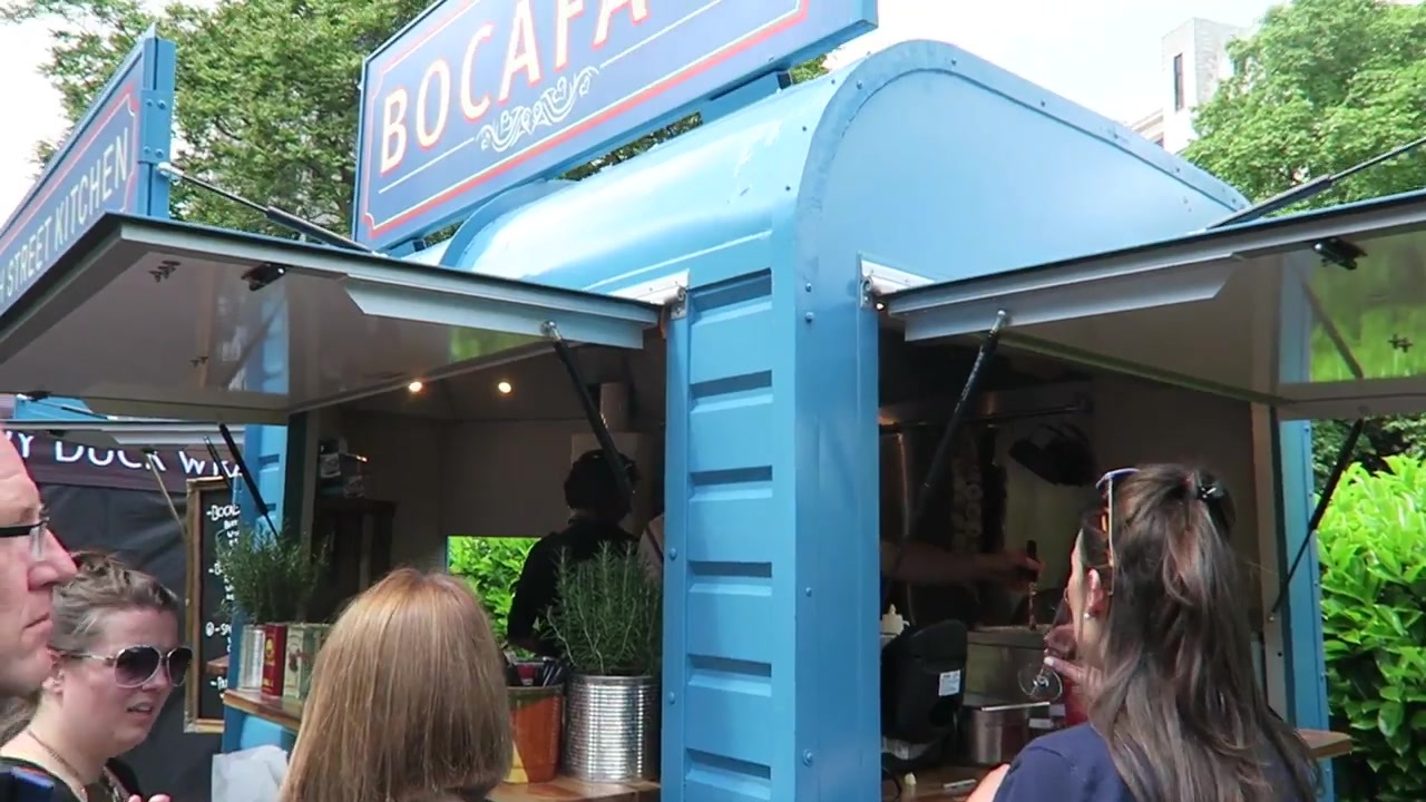 The blue Bocaface street-food van at the market.