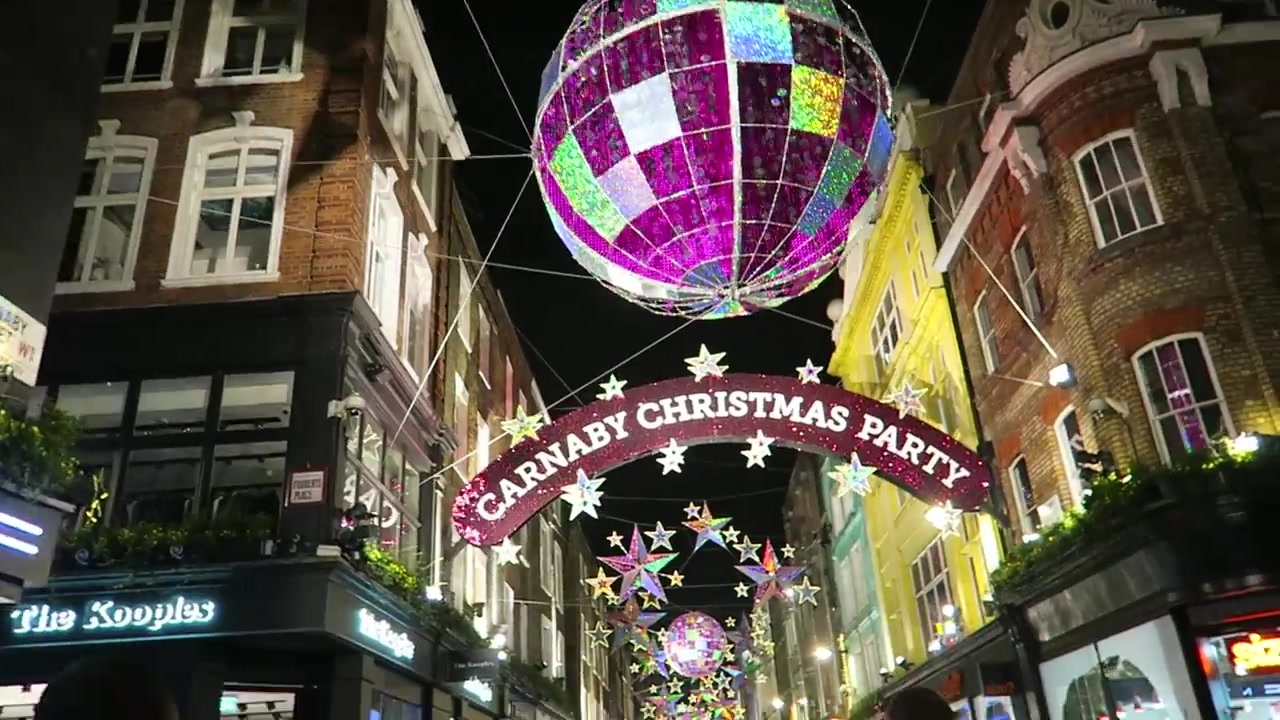 Large illuminated disco ball above the Carnaby Christmas Party sign
