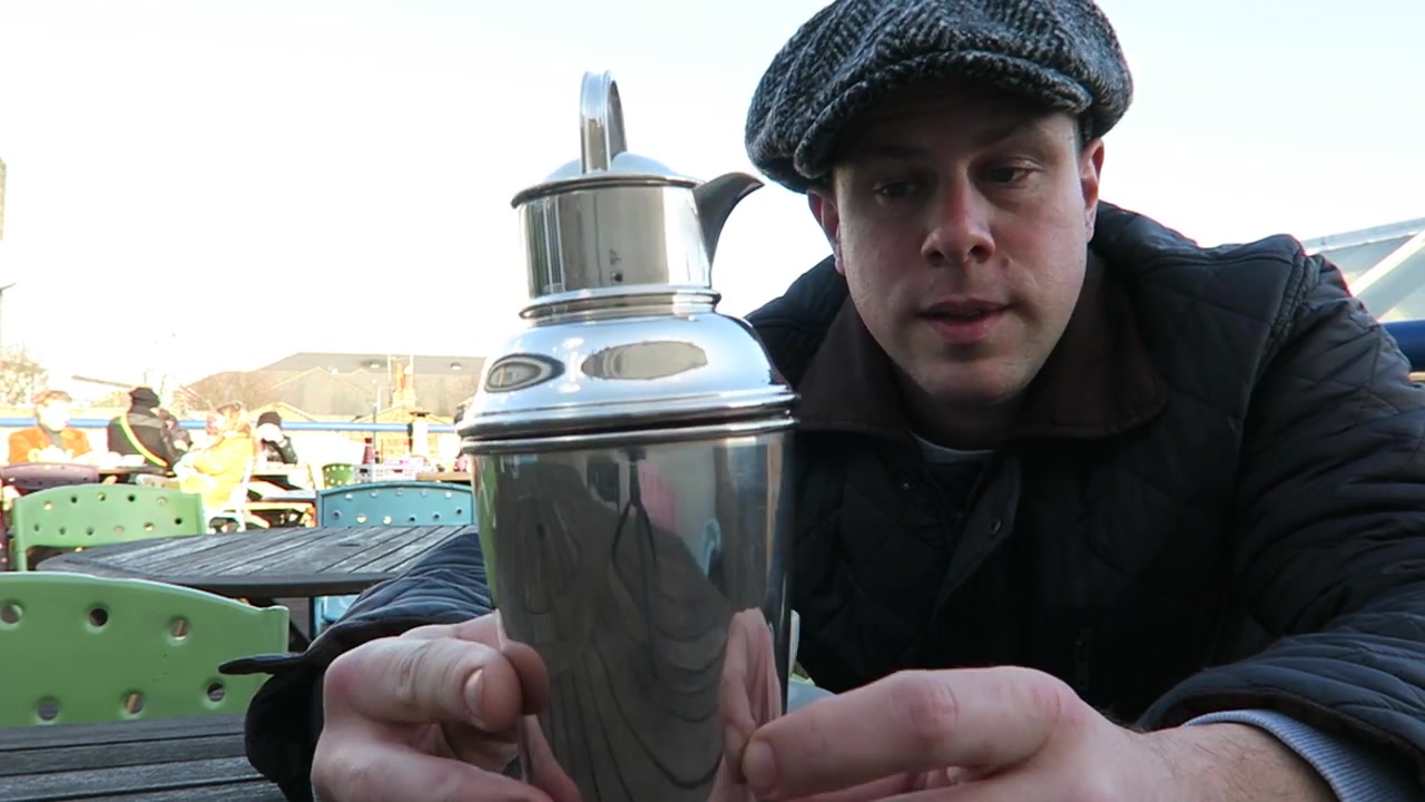 Barry showing a vintage plated cocktail shaker on the Alfies rooftop