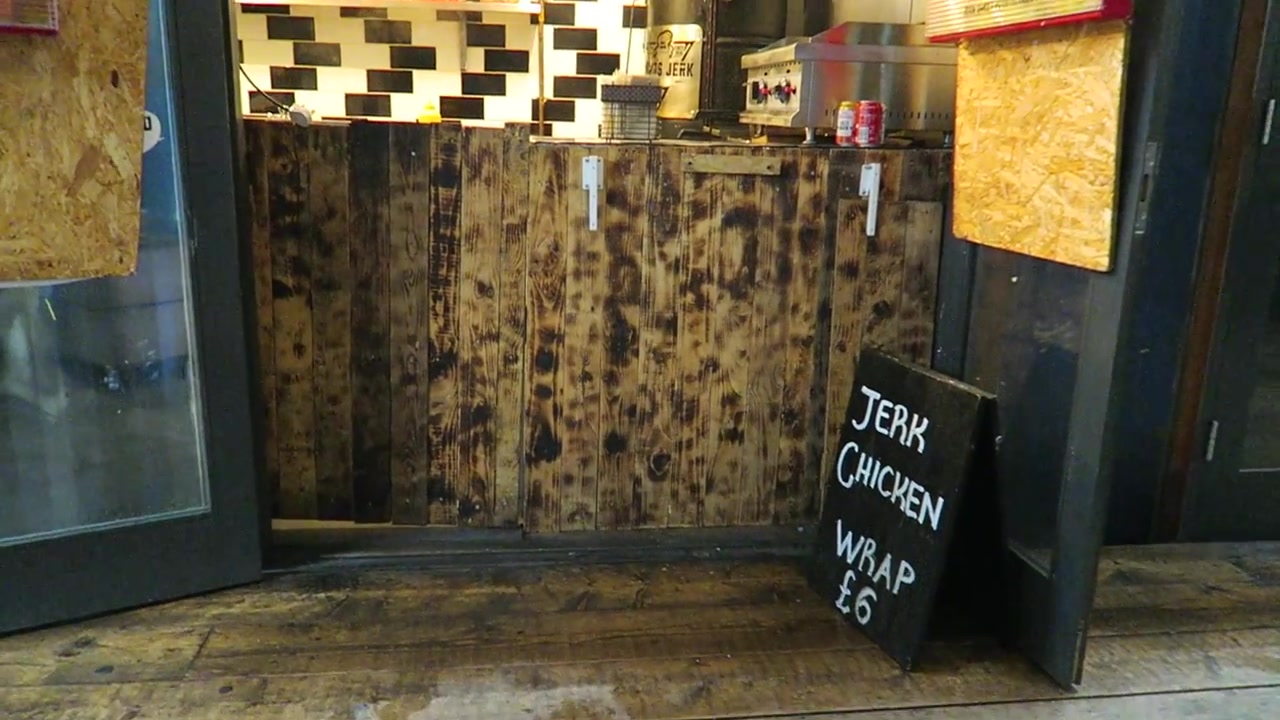 Open serving counter and jerk chicken chalkboard at Mama’s Jerk