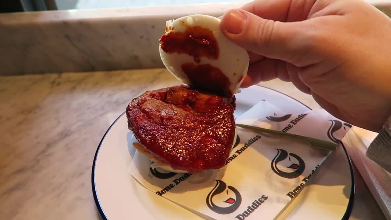 Thick char siu pork inside a steamed bun