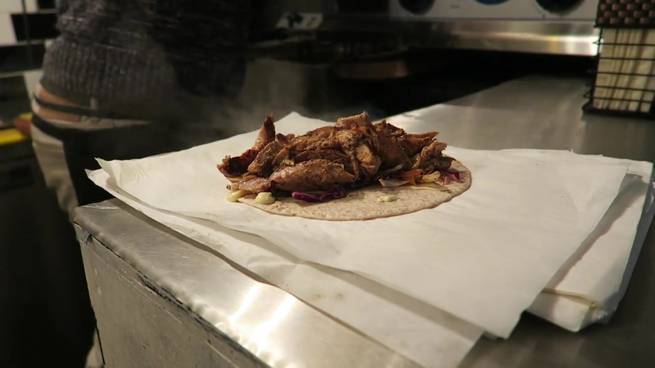 Jerk chicken piled onto a flatbread at Mama’s Jerk