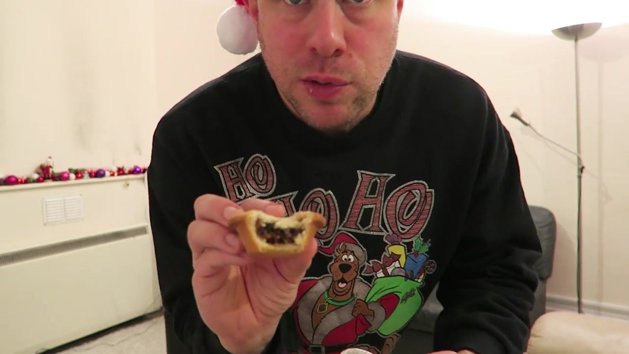 Barry shows the fruit filling inside a bitten mince pie.