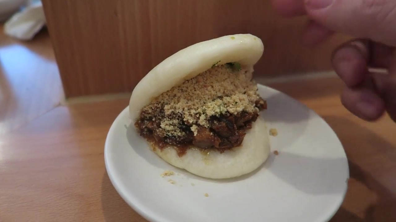 Classic pork bao topped with peanut powder at BAO Soho