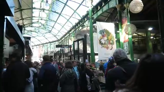 Shoppers beneath the glass roof at Borough Market in 2016.