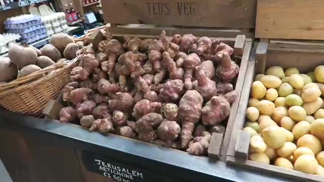 Jerusalem artichokes and potatoes on a Borough Market vegetable stall.