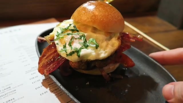 Lobo bun with a fried egg, bacon and pork burger at Lobos Tapas.