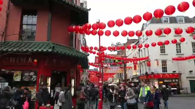 Rows of red lanterns over a busy Chinatown street in London before Chinese New Year in 2016.
