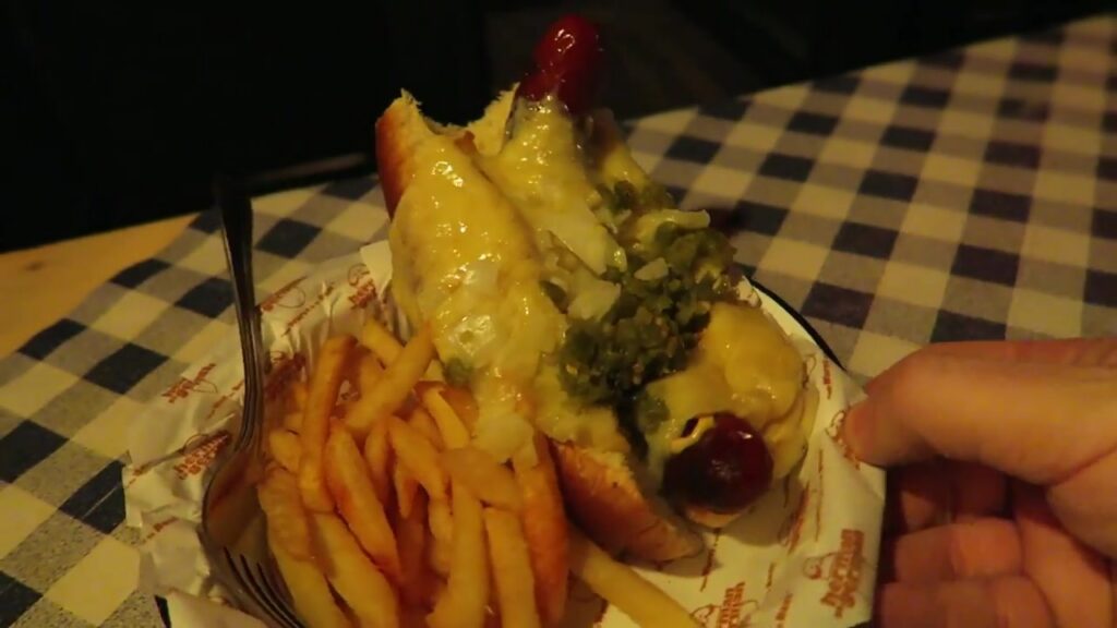 The Über Ding with spicy sausage, cheese, onions and jalapeños at Herman Ze German Soho.