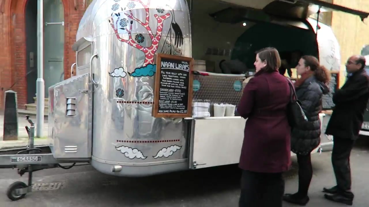 Customers at a Leather Lane food stall during the 2016 market walk