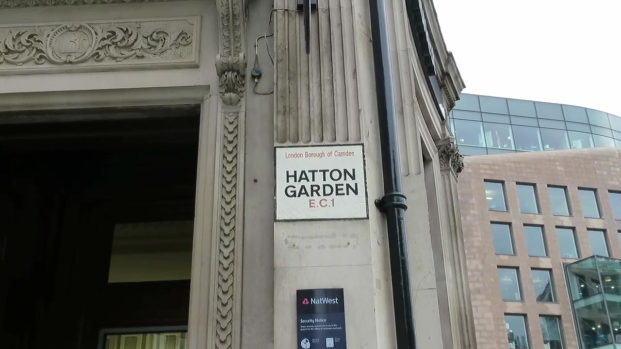 Hatton Garden EC1 street sign beside an ornate doorway