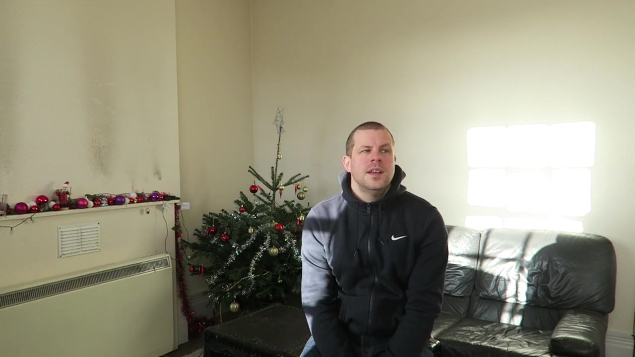 Robert wishing viewers a happy New Year beside the Christmas tree in 2016.