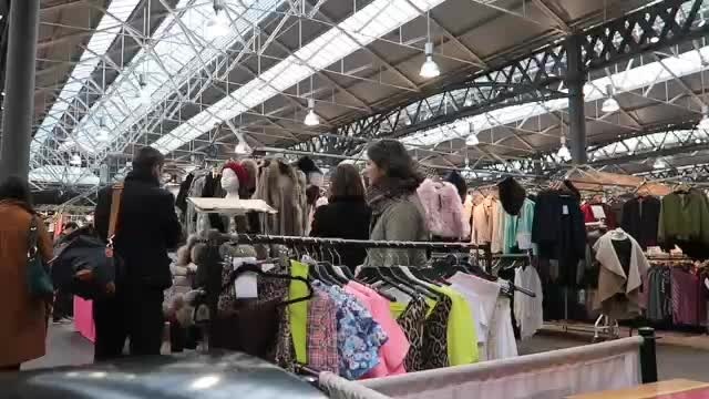 Clothing stalls beneath the roof of Old Spitalfields Market in 2016